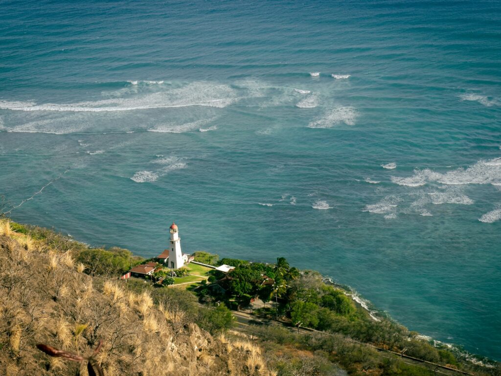 View of Lighthouse and ocean from on top of mountain